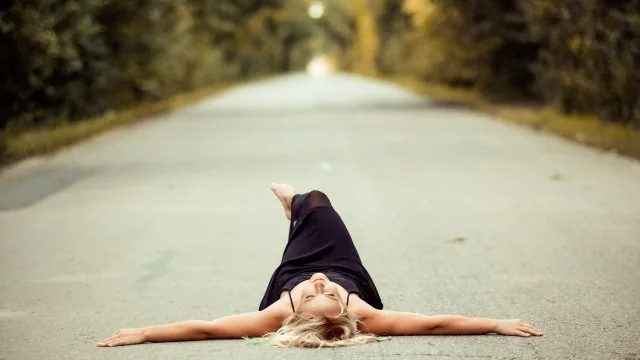 Woman Lying On Road Cute Wallpaper