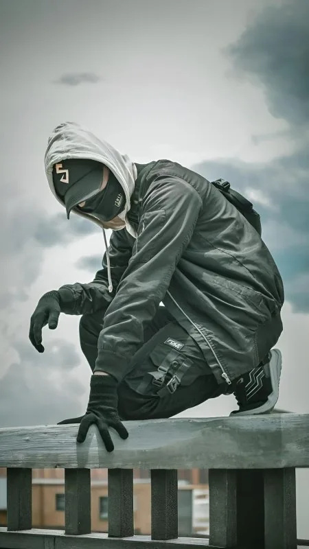 Masked Rooftop Crouch Cool Wallpaper