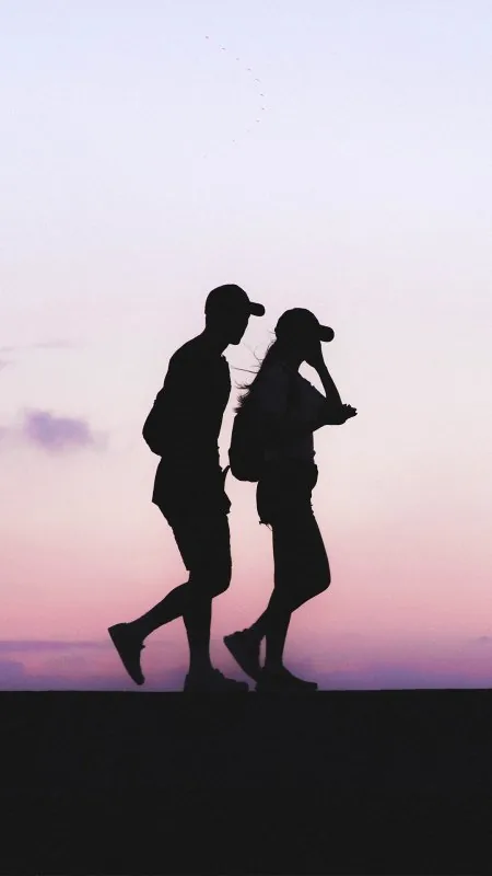 Capped Couple Pink Dusk Love Wallpaper